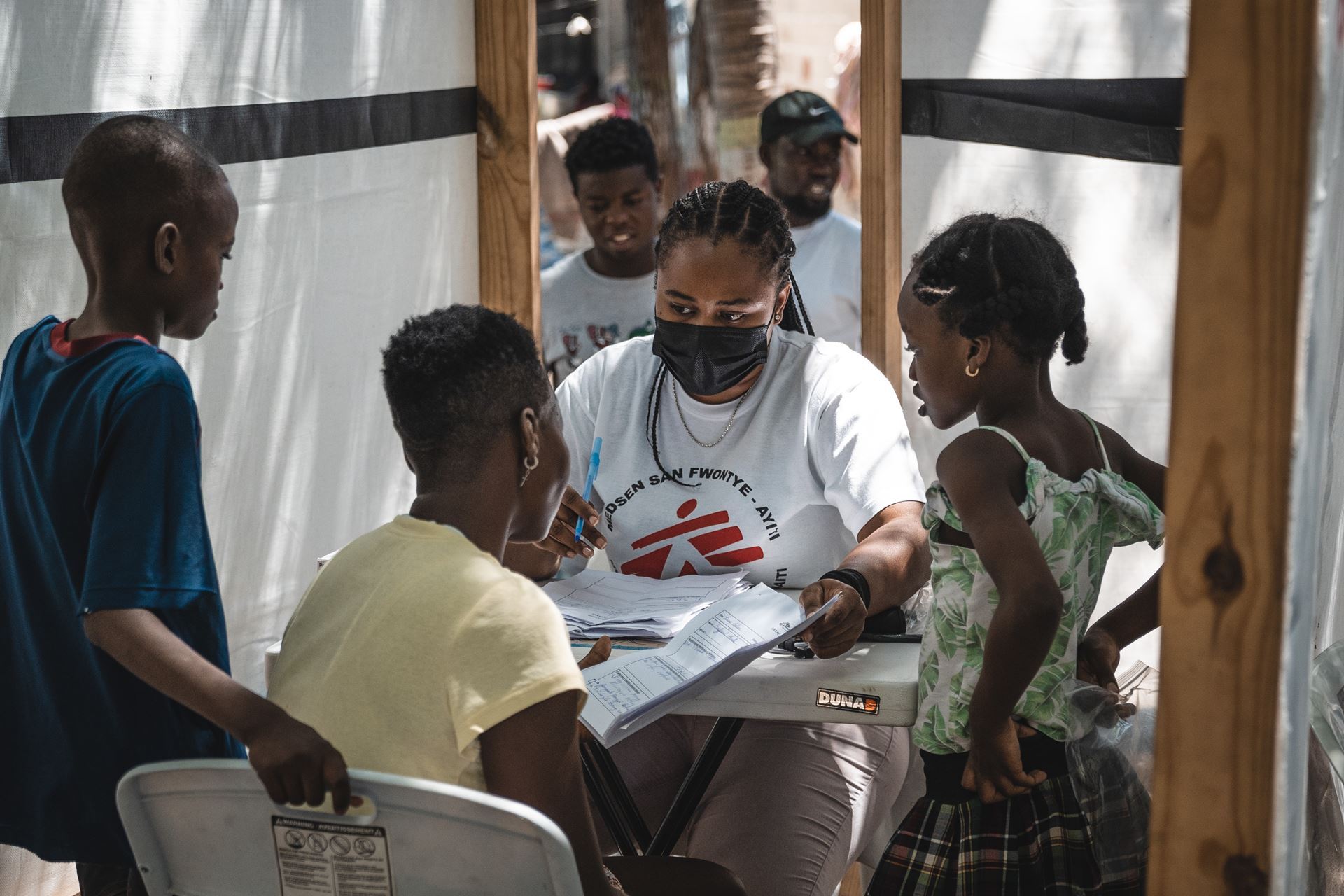 MSF staff speaking to a family